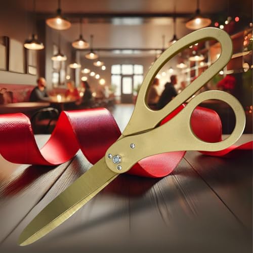 Gold scissors with red ribbon for ribbon cutting ceremonies
