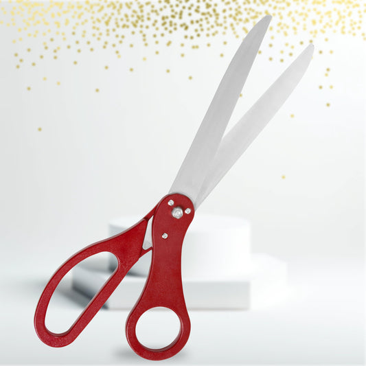 Red-handled ceremonial scissors for a Diwali grand opening ribbon cutting
