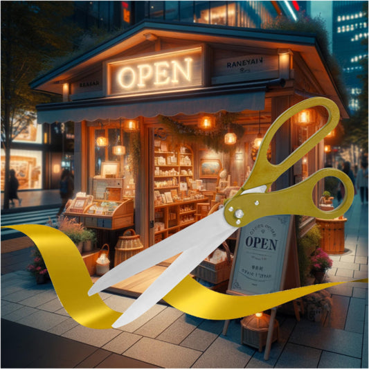 Gold grand opening scissors cutting a yellow ribbon in front of a glowing storefront