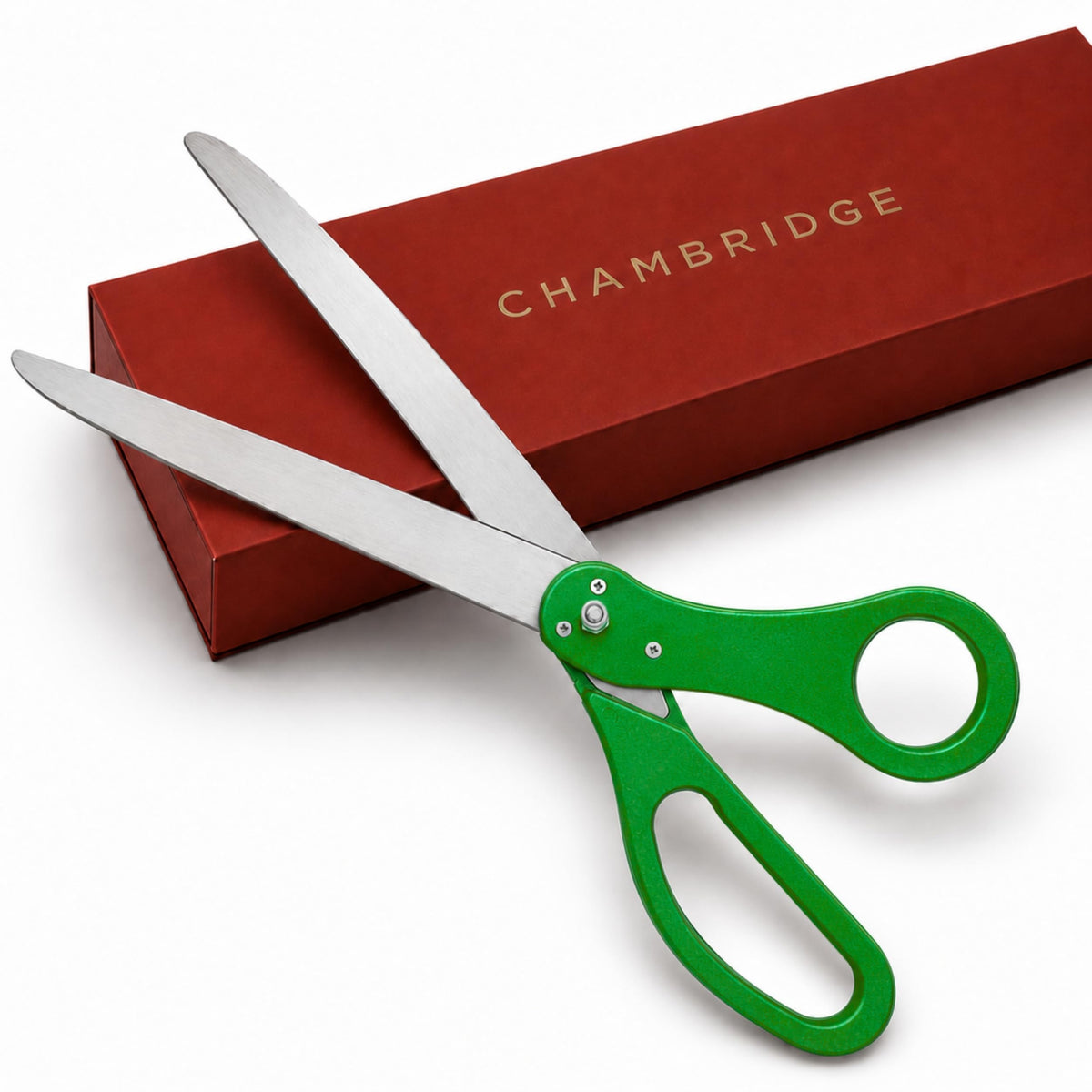 25-inch green ceremonial scissors with stainless steel blades resting on a red Chambridge gift box, white background