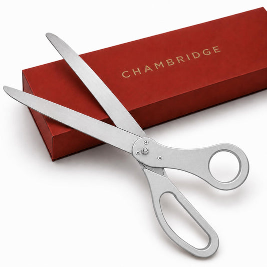 25-inch silver ceremonial scissors with polished stainless steel blades resting on a red Chambridge gift box