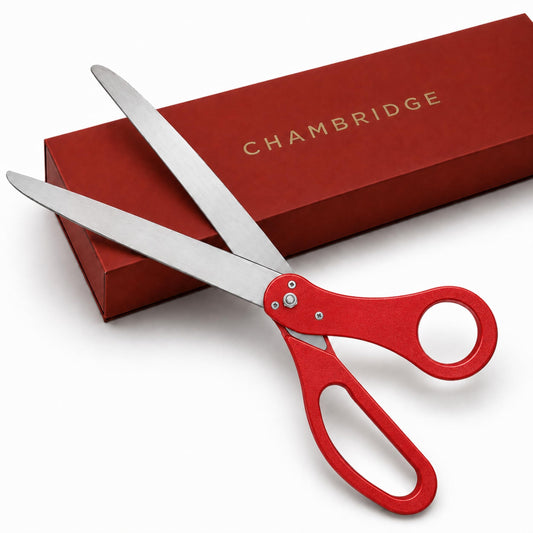 25-inch red grand opening scissors with polished stainless steel blades resting on a red Chambridge gift box