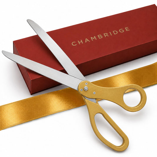 25-inch gold ceremonial scissors with gold satin ribbon resting against a red Chambridge gift box