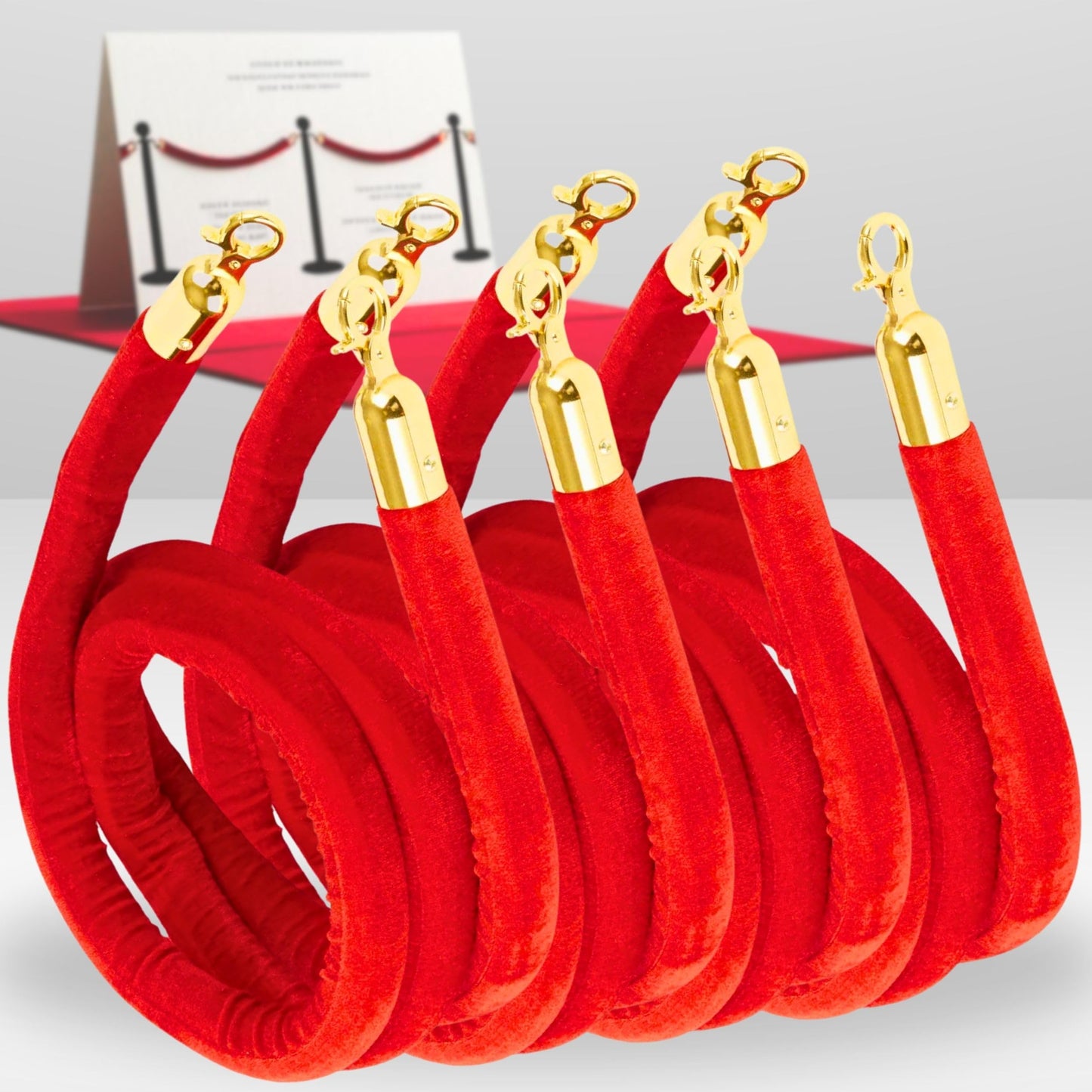 Four coiled red velvet ropes with gold clasps for VIP event barriers
