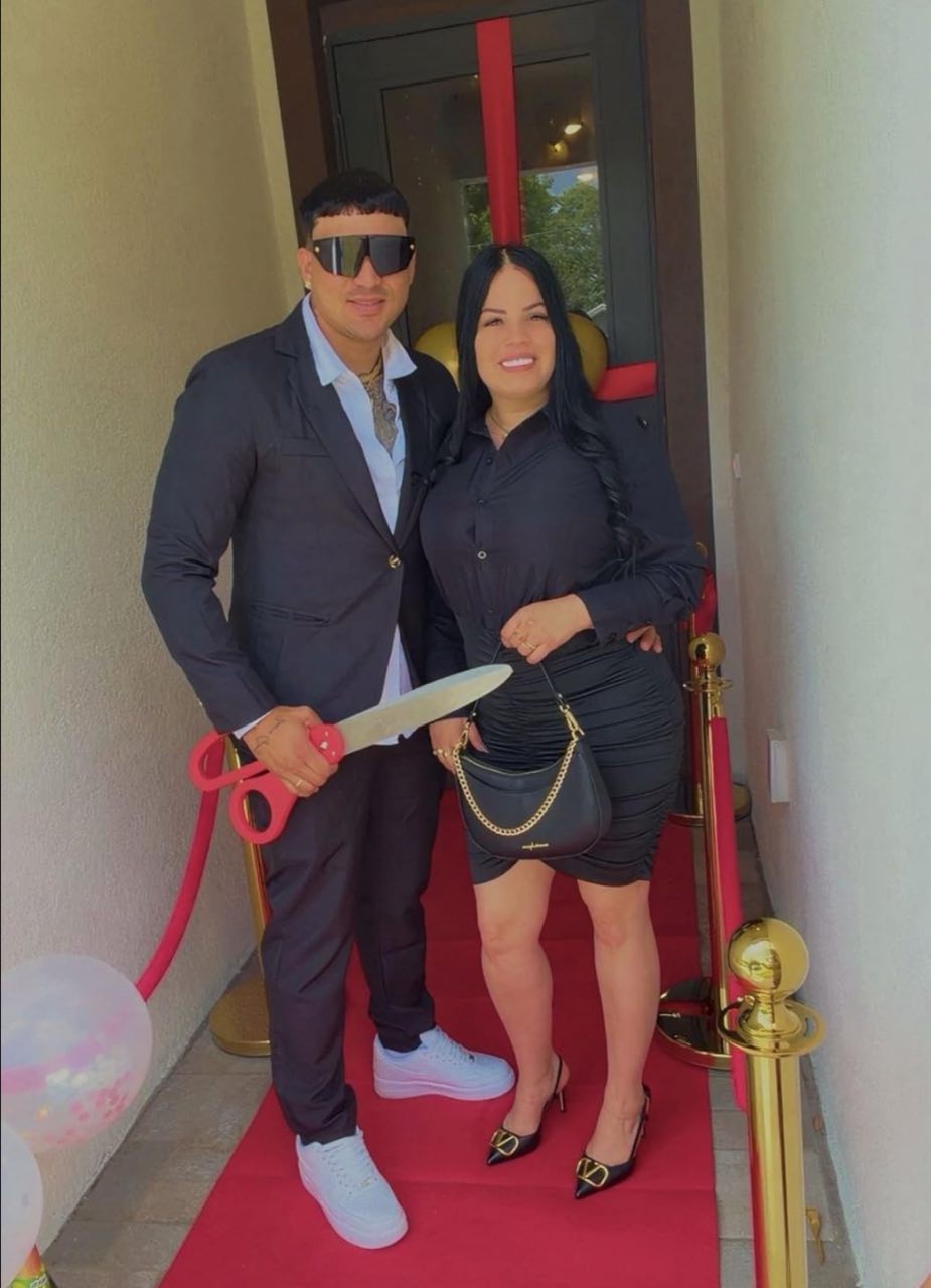 Customers cutting the ribbon with Chambridge 25-inch red ceremonial scissors at their grand opening